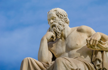 Close-up of a greatest philosopher of Greece Socrates reflects on the meaning of life on the background of blue sky.