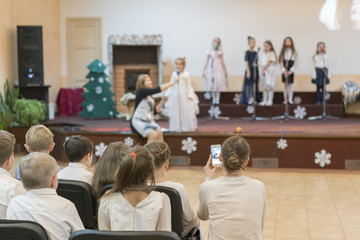 Little children perform on stage