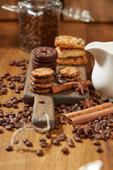 Aroma coffee candy chocolate cookies and spices on the wooden table. Christmas sweets. Dark wooden background. Top view. Close. Closeup.