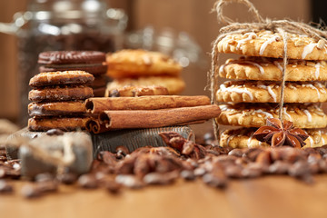 Aroma coffee candy chocolate cookies and spices on the wooden table. Christmas sweets. Dark wooden background. Top view. Close. Closeup.