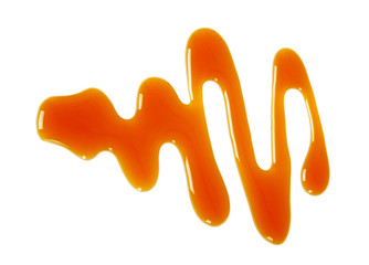 Sweet caramel sauce isolated on white background
