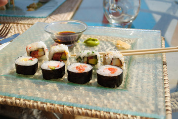 Sushi roll with prawn, avocado, cream cheese, sesame.