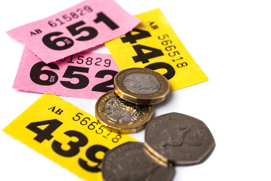 Yellow and Pink Raffle Tickets with UK Coins with negative space