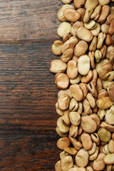 raw beans are scattered in a row