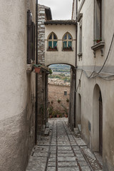 Spectacular traditional italian medieval alley in the historic center of beautiful little town of Spello (Perugia), in Umbria region -  central Italy