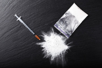 syringe and white powder in the package
