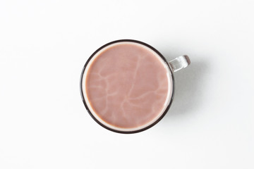 Obraz na płótnie Canvas Winter drink. Warm cocoa with milk on a white background.Flat lay. Morning light