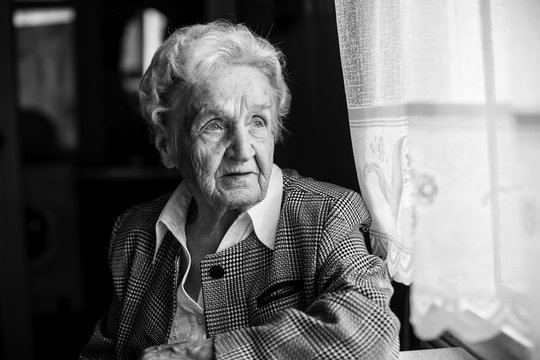 An elderly woman black and white portrait.