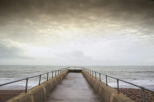 Atmospheric and Moody Long Exposure Photograph of Stone Pier at Brighton, East Sussex, England, UK with copy space
