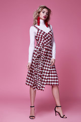 Pretty woman beautiful sexy lady wear fashion designer dress evening party celebrate holiday curly blond hair makeup style glamour clothes model pose catalog accessory jewelry earrings fashionable.