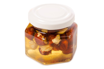 A honey jar with nuts