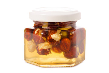 A honey jar with nuts