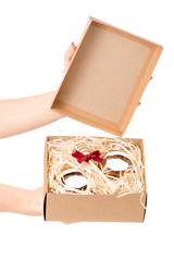Box with jars of honey set gift present in hands isolated