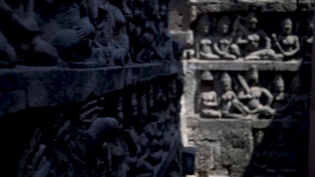 Steadicam motion through the Terrace of the Elephants meandering walkway with bas relief sculptures.