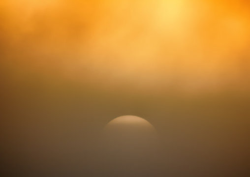 Setting Sun In The Misty Haze