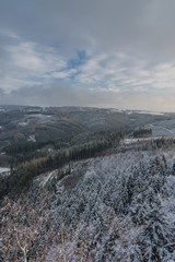 View from Semnicka rock with cloudy sun and snow in west Bohemia