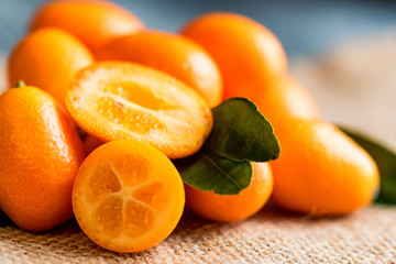 Kumquat or cumquat on wooden table