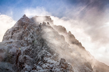 Winter view of Mount Pelmo summit with clouds, Dolomites, Italy