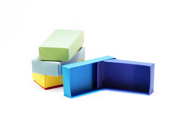 Few colorful paper boxes of colored cardboard for packing bow ties and other gifts on a white background. Hand made