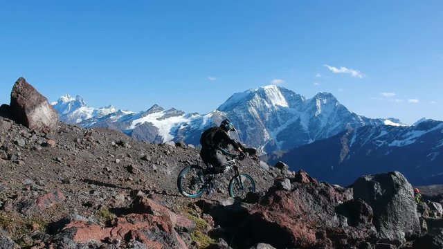 Man starts his ride in high mountains.
