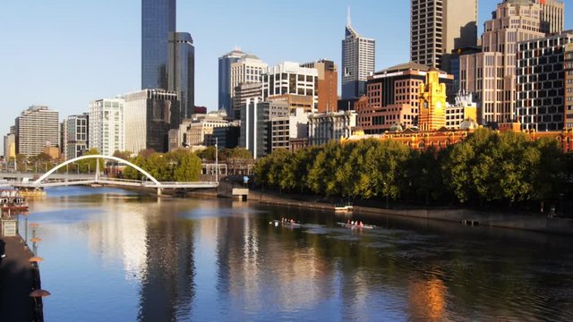 a morning view of the yarra river and the city skyline in melbourne, australia