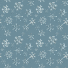 Seamless pattern of hand-drawn black-and-white snowflake 