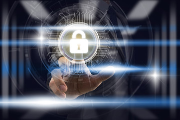 Businessman Finger touching the key icon for security access over the light from blurred server room background, Cyber Security Data Protection support Technology Privacy concept.