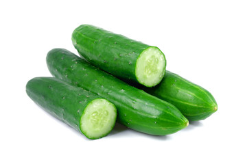 Cucumber and slices isolated over white background
