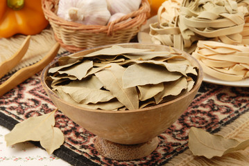 Bay leaves in the wood bowl