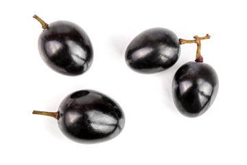 Dark grapes isolated on white background, top view. Flat lay