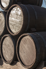 Wooden barrels in a pile. Closeup.