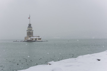 Snowy day in Uskudar. View of Maiden's Tower in Uskudar, Istanbul, Turkey.