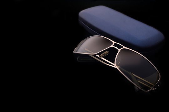 Sunglasses With Case On Black Background