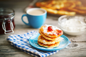 Delicious pancakes on wooden table with Cup of coffee and jam