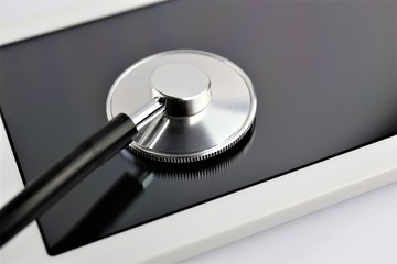 An concept Image of a smart tablet with a stethoscope