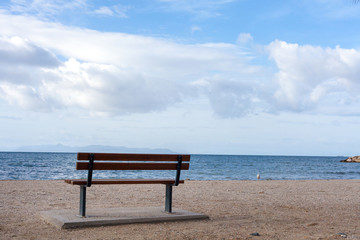 Fototapeta na wymiar lonely bench by the sea