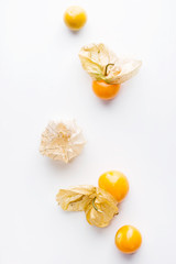 Beautiful orange gooseberries on white background. Vegetarian food concept. Detox