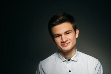 young brunette guy in a white shirt