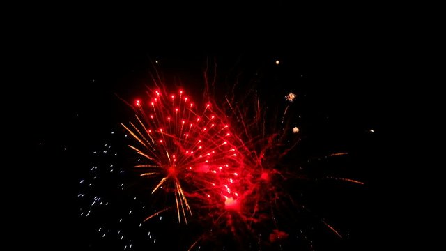 Colorful fireworks at holiday night. 4к video of salutes.

