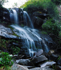 Obraz premium Waterfall at the carpatian mountains green forest