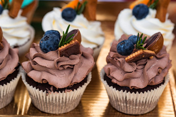 Delicious pastries with berries and butter cream