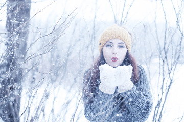 Beautiful girl in a beautiful winter snow