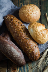 Assortment of bread on a wooden background