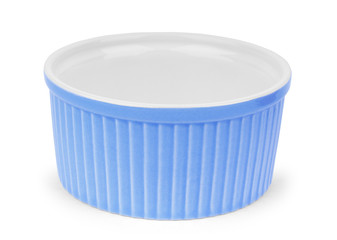 Small glazed ceramic ramekin isolated on white