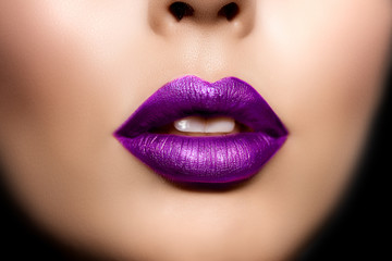 Red woman lips, mouth close up. Beautiful model girl with lipstick plum wine color. Products...