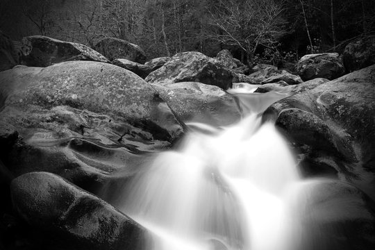 Blurred Motion and Slow Shutter Waterscape Black and White Photography of a River Waterfall in the Great Smoky Mountains.