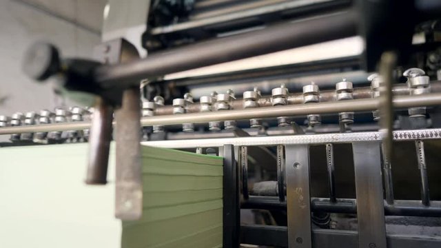 Process of Offset Print on Vintage Old Printing Machine in Retro Style Typography. 4K.