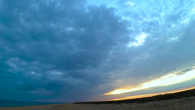 sunset on the wild beach time lapse