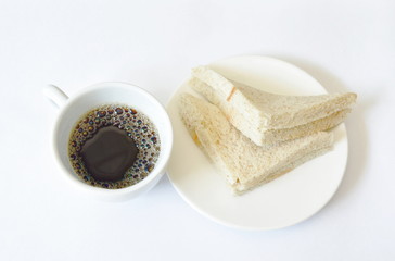 tuna whole wheat sandwich on plate eat couple with black coffee cup