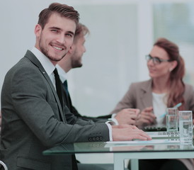Business people working around table in modern office